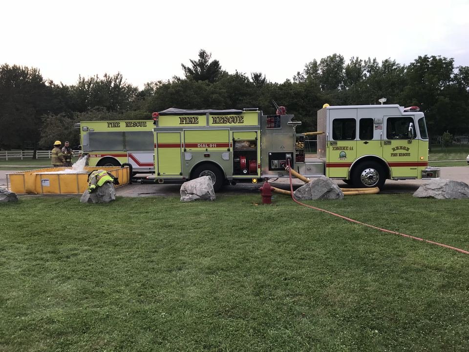 Engine 11 beside a portable water tank